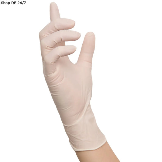 Eine hand trägt einen blassen latex einmalhandschuh polymer soft für medizinische einrichtungen mit komfort und schutz
