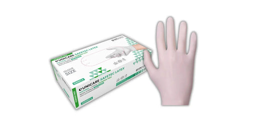 Einmalhandschuhe aus latex in blassrosa neben weiß-grüner safetec verpackung für medizin pflege und industrie